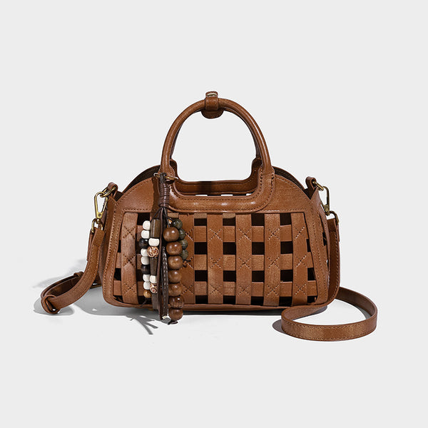 Small structured woven lattice top-handle satchel bag with bead-and-tassel charm and gold-tone hardware, detail view 10