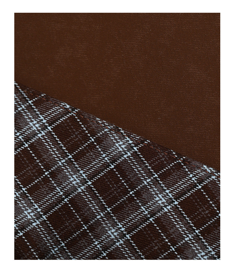 Brown structured tote bag with woven plaid fold-over top panel, silver-tone ring hardware, and long flat shoulder straps