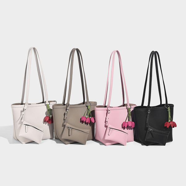 Structured pebbled leather-look tote bag in taupe with long shoulder strap, detachable zip pouch, and pink tulip flower