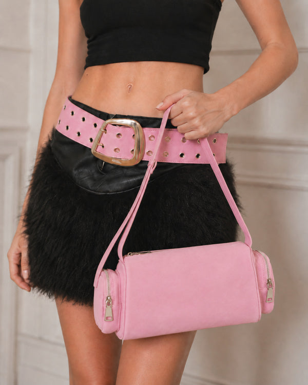 Mini barrel shoulder bag with side zip pouches and adjustable strap in pink suede-like finish, detail view 11