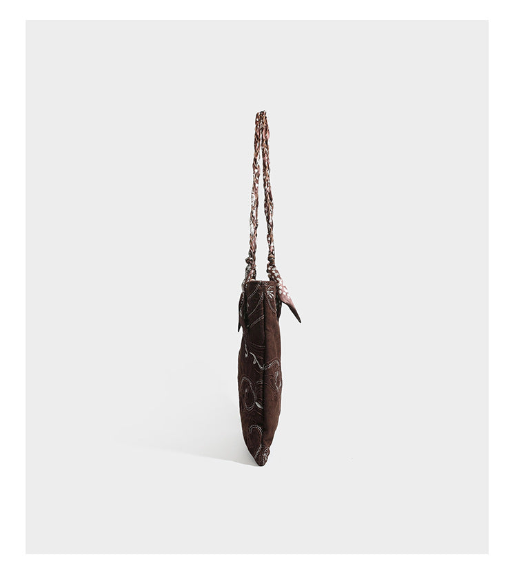 Brown suede-finish tote bag with paisley embroidery and braided fabric-ribbon shoulder strap, detail view 26