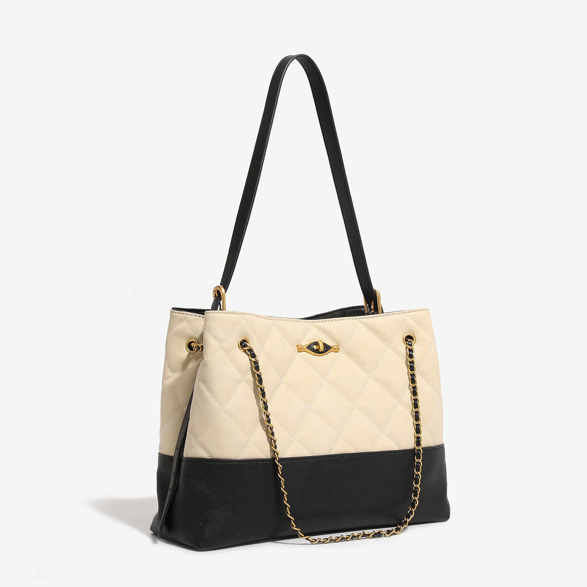 Large quilted two-tone shoulder tote bag with gold-tone chain handles and eye-shaped clasp hardware, detail view 3