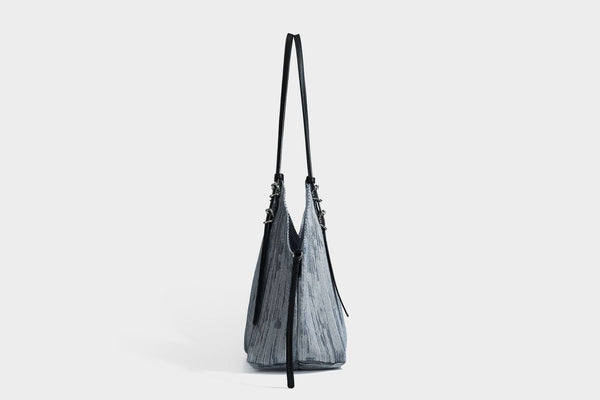 Large slouchy woven-texture shoulder tote bag with slim leather-look straps, side cinch ties, and silver-tone hardware