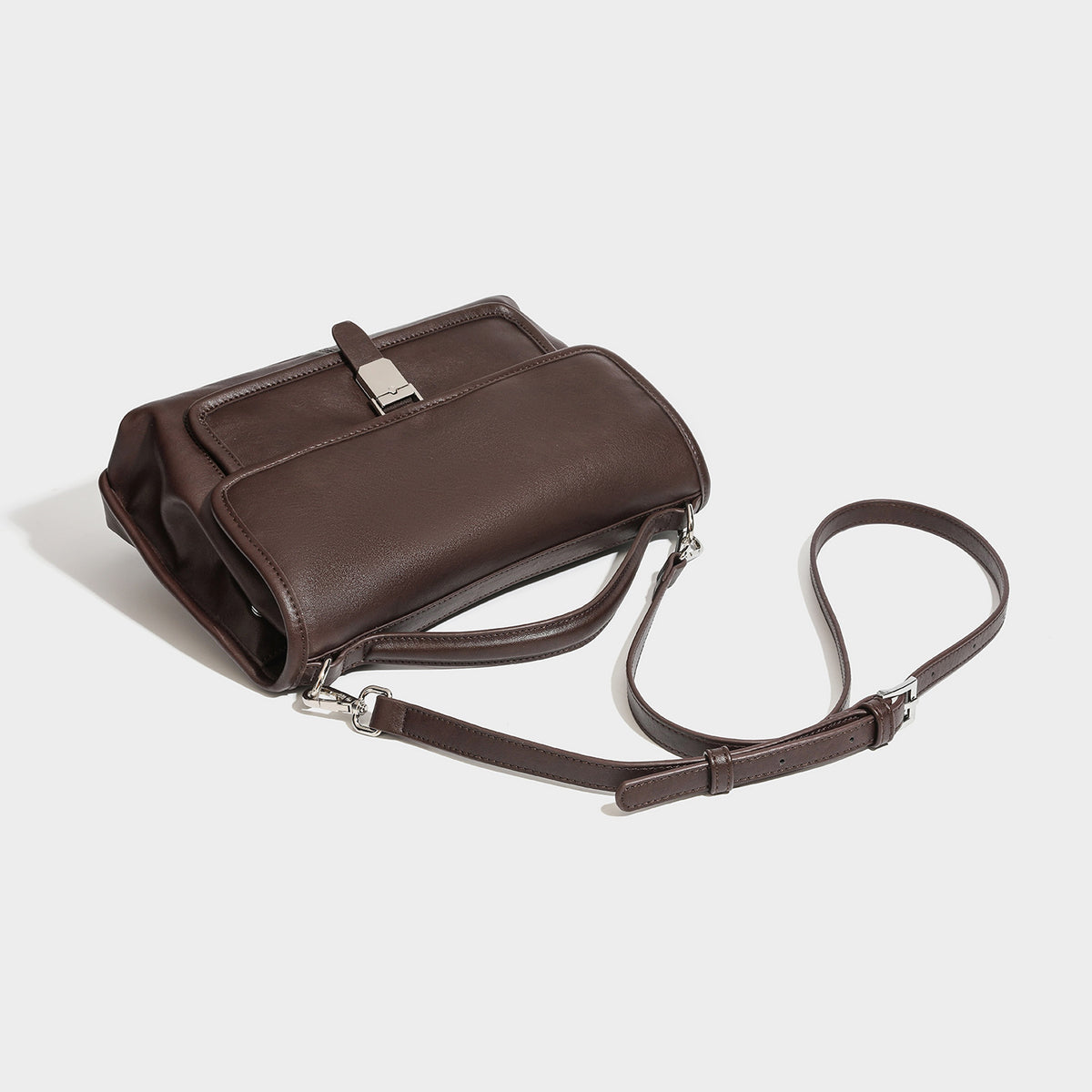 Structured rectangular satchel bag in dark espresso brown with smooth leather-look finish, flap front with silver turn-lock