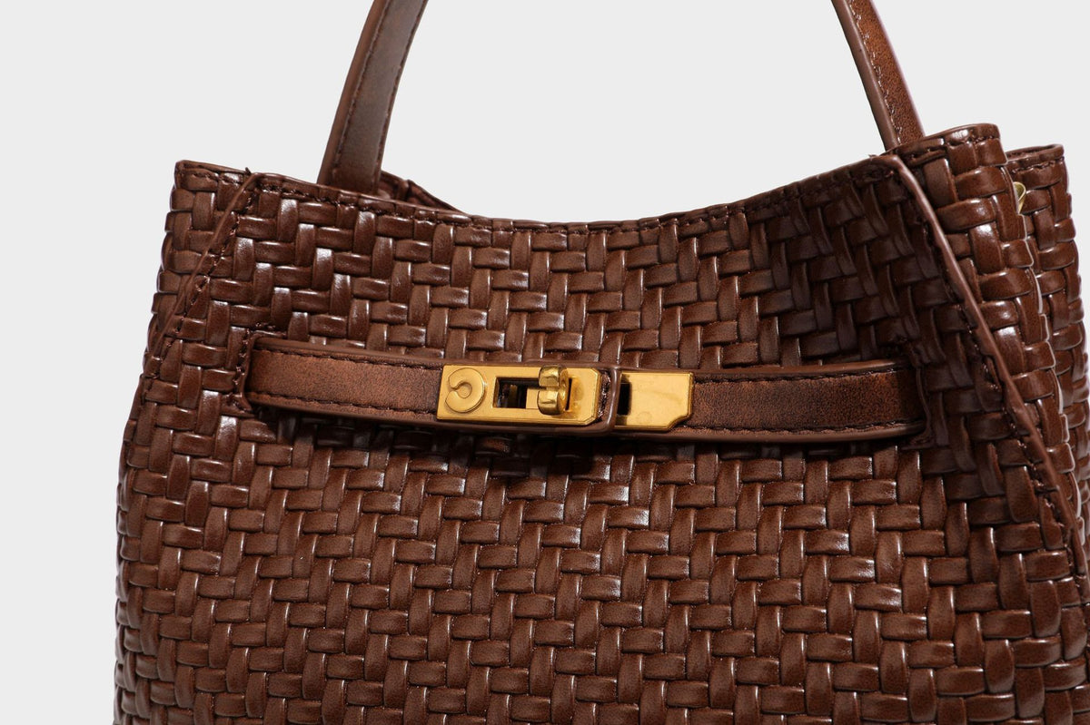 Structured woven leather-look bucket bag with gold-tone turn-lock hardware and detachable shoulder strap, detail view 35