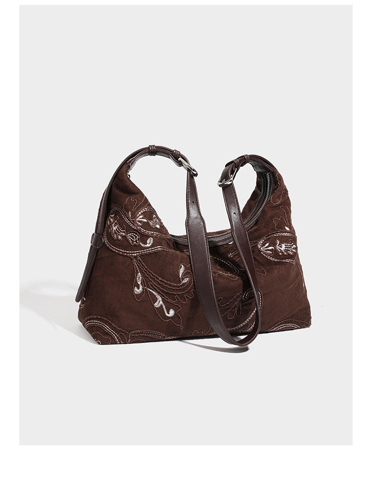 Deep chocolate suede-look hobo shoulder bag with tonal paisley floral embroidery, smooth dark leather-look trim, top zip