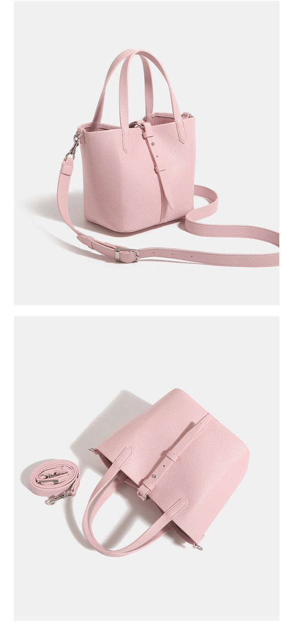 Small structured pebbled leather-look bucket tote bag with dual top handles and silver-tone hardware, detail view 14