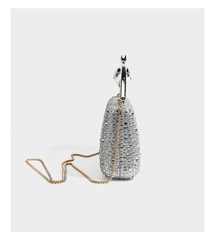 rectangular hard-case rhinestone evening clutch with sculptural gold-tone branch-and-bud top handle and detachable chain