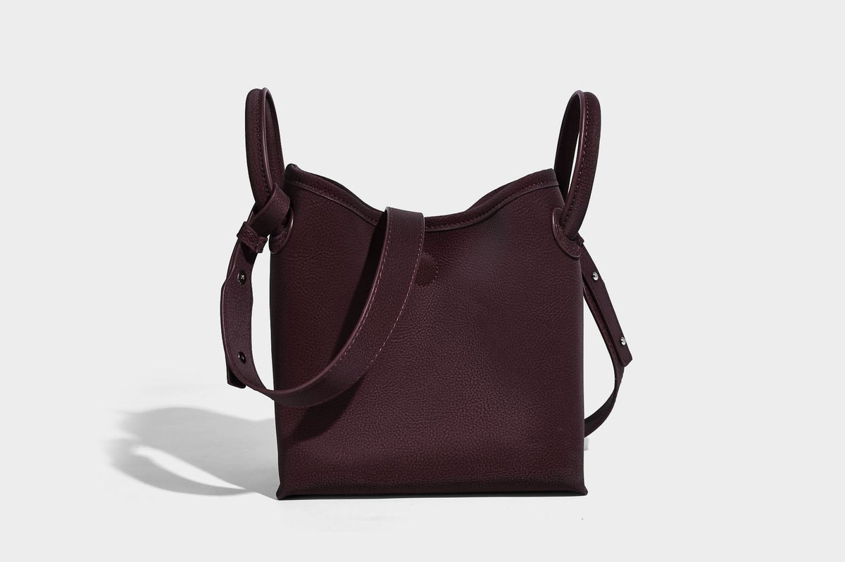 Small structured matte pebbled tote bag with twin top handles and removable zip pouch, detail view 29