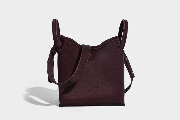 Small structured matte pebbled tote bag with twin top handles and removable zip pouch, detail view 29