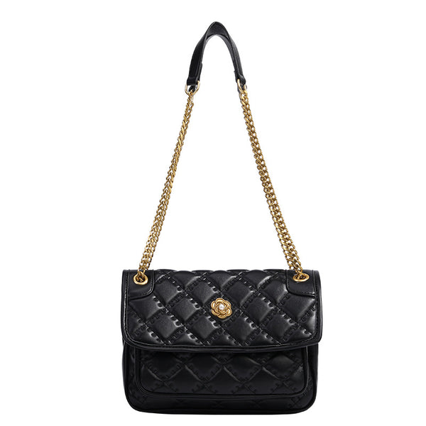 Compact diamond-quilted flap shoulder bag with gold-tone chain strap and floral turn-lock clasp, detail view 5