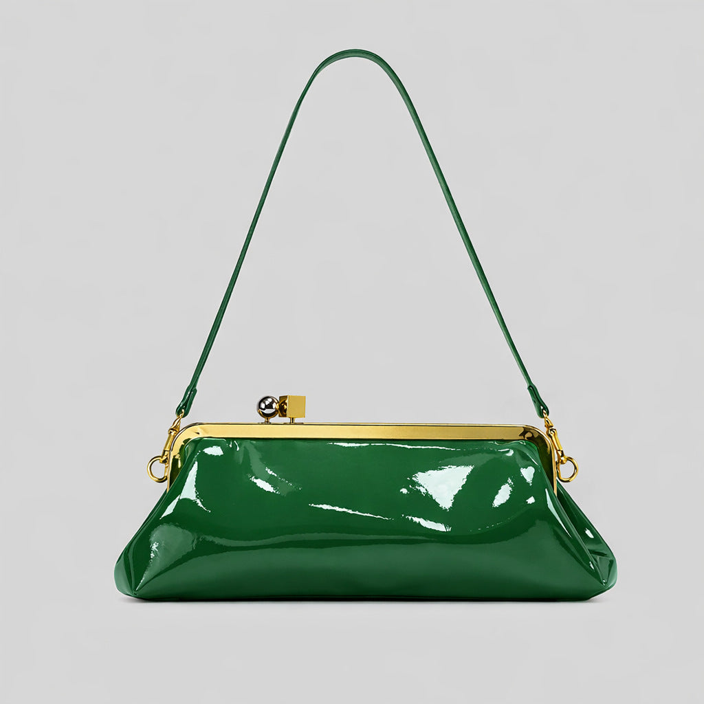 Strukturierte Clutch mit Kiss-Lock-Rahmenverschluss aus dunkelbrauner, krokodil-geprägter Lederoptik mit goldfarbenen Details und schmalem