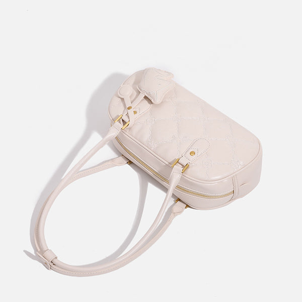 Small structured quilted leather-look zip shoulder bag with gold-tone hardware and adjustable strap, detail view 4