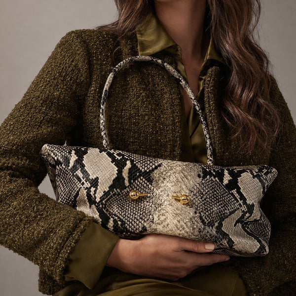 Wide embossed-texture shoulder tote bag with single loop handle and gold-tone toggle hardware, detail view 3