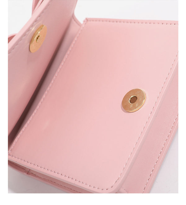 Small structured rectangular crossbody bag with layered 3D flower appliqué and gold-tone chain strap, detail view 20