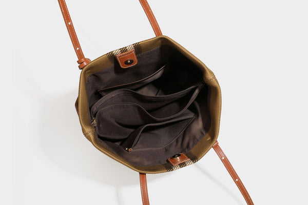 Large structured plaid check tote bag with smooth tan leather-look shoulder straps, attached front zip pouch, and gold-tone