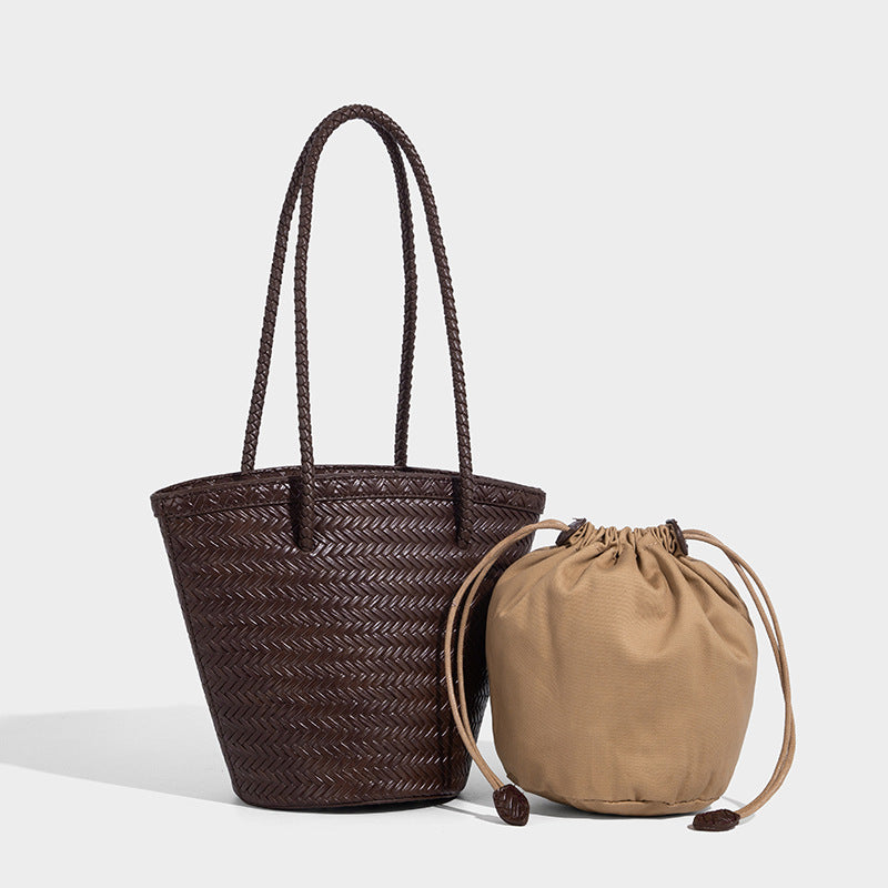 Chevron-woven bucket tote bag with braided shoulder straps and matching drawstring pouch, front view