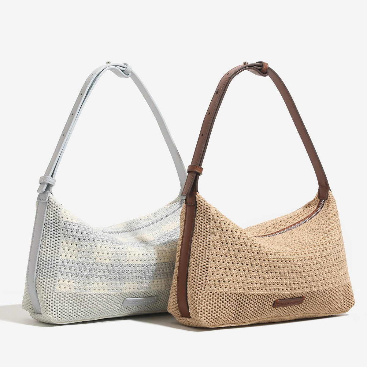 Woven crescent hobo shoulder bag with adjustable leather-look strap and top zip closure, front view
