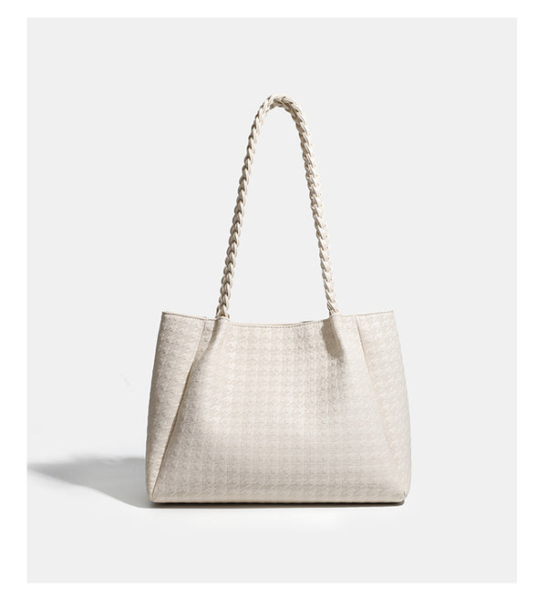 Structured geometric-embossed tote bag with braided shoulder straps and gold-tone hardware in ivory, detail view 11