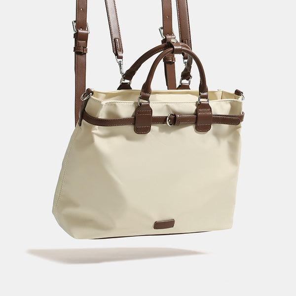 Strukturierte wandelbare Tote-Bag aus mattem Nylon mit braunem Besatz in Kunstlederoptik, Schnallengurt-Detail und Beschlägen in Silberoptik