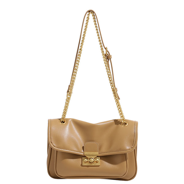 Smooth leather-look flap crossbody bag with chunky gold-tone chain strap and double-knob twist lock, detail view 5