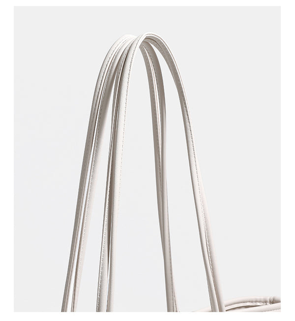 Off-white structured tote bag with dual shoulder straps, gold-tone hardware, and plush bear charm, detail view 14