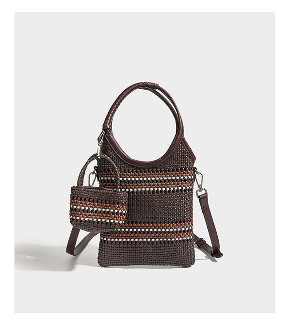 Color-block woven tote bag with rounded leather-look handles, detachable crossbody strap, and matching mini clip-on pouch in