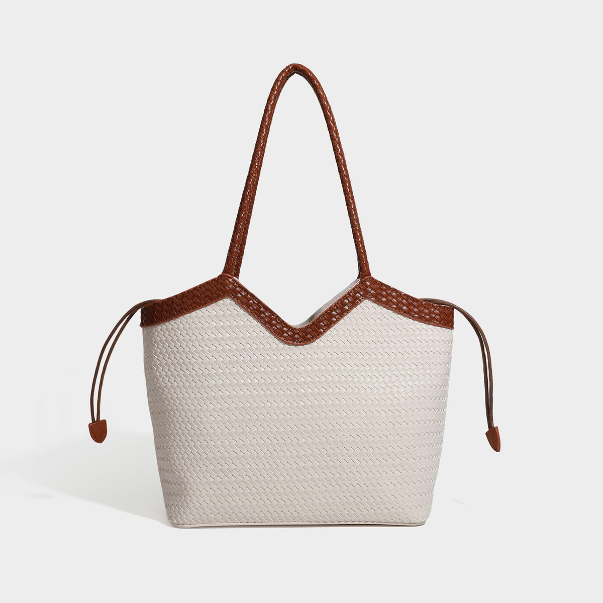 Woven tote bag with braided shoulder straps, drawstring closure, and dangling metal-and-bead charm, detail view 4