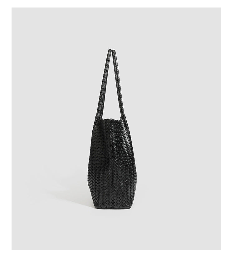 Large black basket-weave leather-look tote bag with long braided shoulder straps and matching woven zip pouch, detail view 14