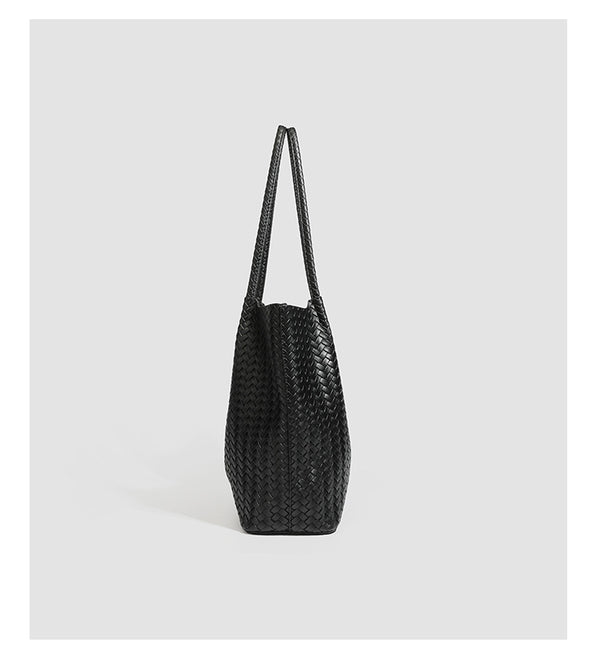 Large black basket-weave leather-look tote bag with long braided shoulder straps and matching woven zip pouch, detail view 14