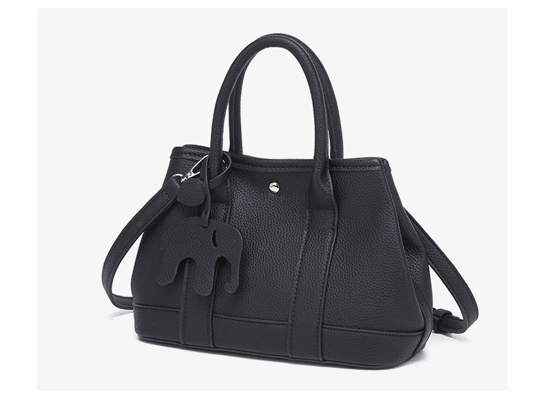 Structured pebbled leather-look top-handle tote bag with elephant charm and detachable shoulder strap, detail view 21