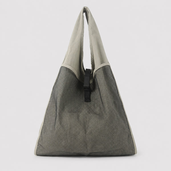 Oversized triangular mesh tote bag with matte olive-khaki fabric straps and trim, dark open-weave mesh body, matte black