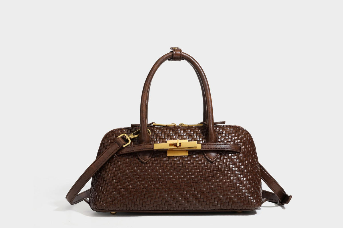 Structured woven-embossed leather-look satchel with dual rolled top handles, gold-tone turn-lock closure, and detachable