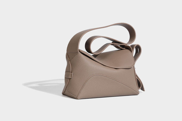 Structured curved-flap pebbled PU shoulder bag with sculptural loop strap detail, detail view 7