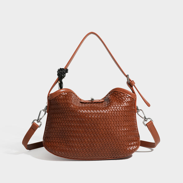 Small woven-look leather-look flap shoulder hobo bag in burgundy with silver-tone hardware and decorative tassel charm