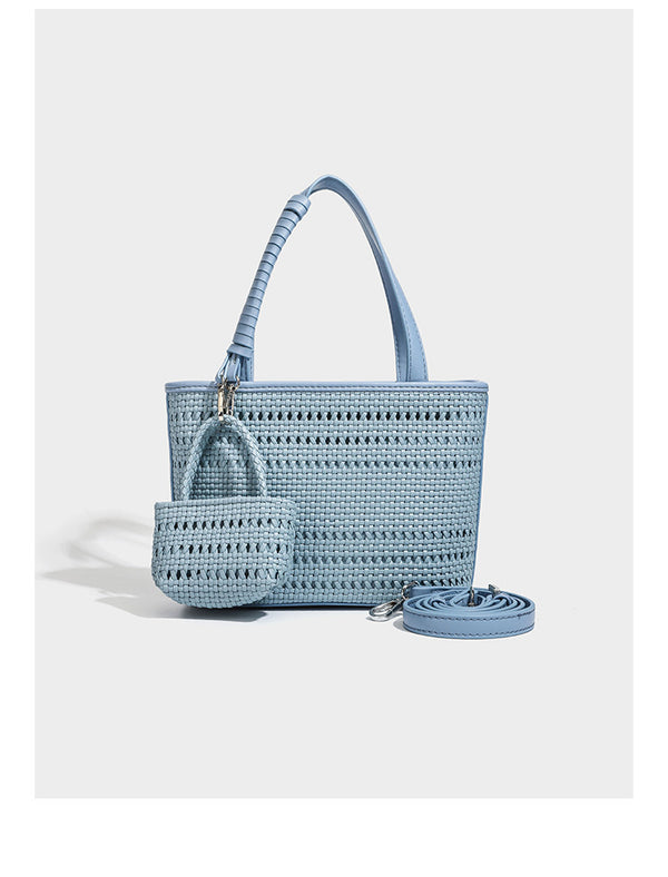 Structured open-weave tote bag with smooth leather-look trim, double top handles, detachable crossbody strap, and mini zip