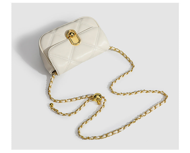 Compact diamond-quilted mini crossbody bag with gold-tone turn-lock closure and woven chain strap, detail view 11