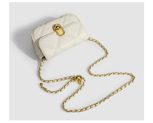 Compact diamond-quilted mini crossbody bag with gold-tone turn-lock closure and woven chain strap, detail view 11