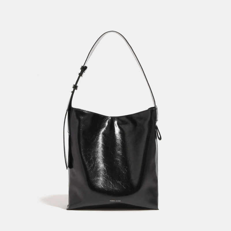Glossy leather-look oversized shoulder tote bag with wide flat strap and soft rectangular silhouette, detail view 6
