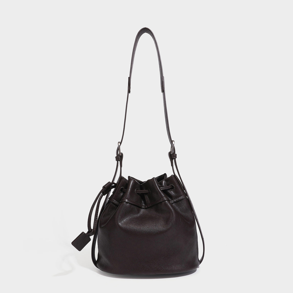 Small pebbled leather-look drawstring bucket bag with adjustable crossbody strap and silver-tone hardware, front view