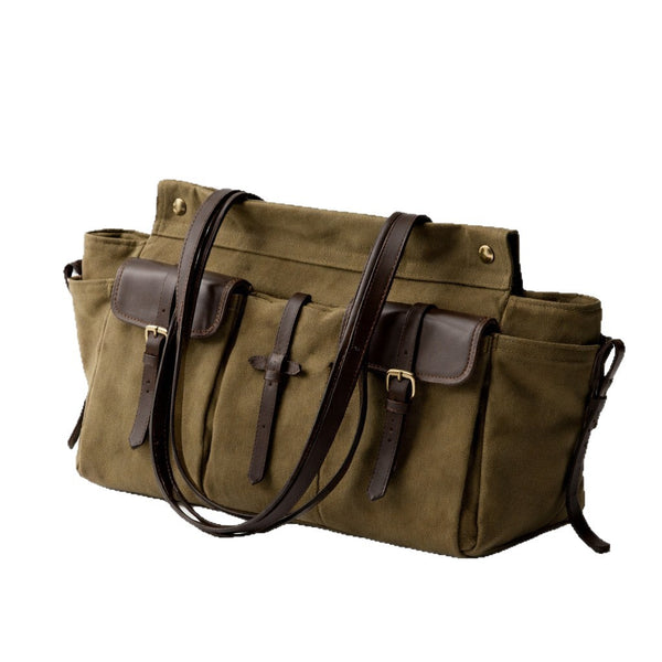 Large olive canvas shoulder tote bag with multiple front buckle-strap pockets and dark brown leather-look trim, detail view 5