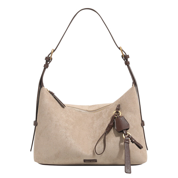 Sand beige slouchy hobo shoulder bag with dark brown trim, adjustable strap, gold-tone hardware, and decorative charm