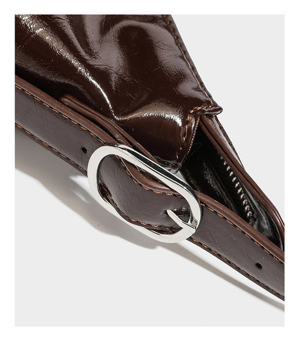 Glossy dark brown hobo shoulder bag with slim strap, front zip pocket, stud detail, and detachable leopard-print heart charm