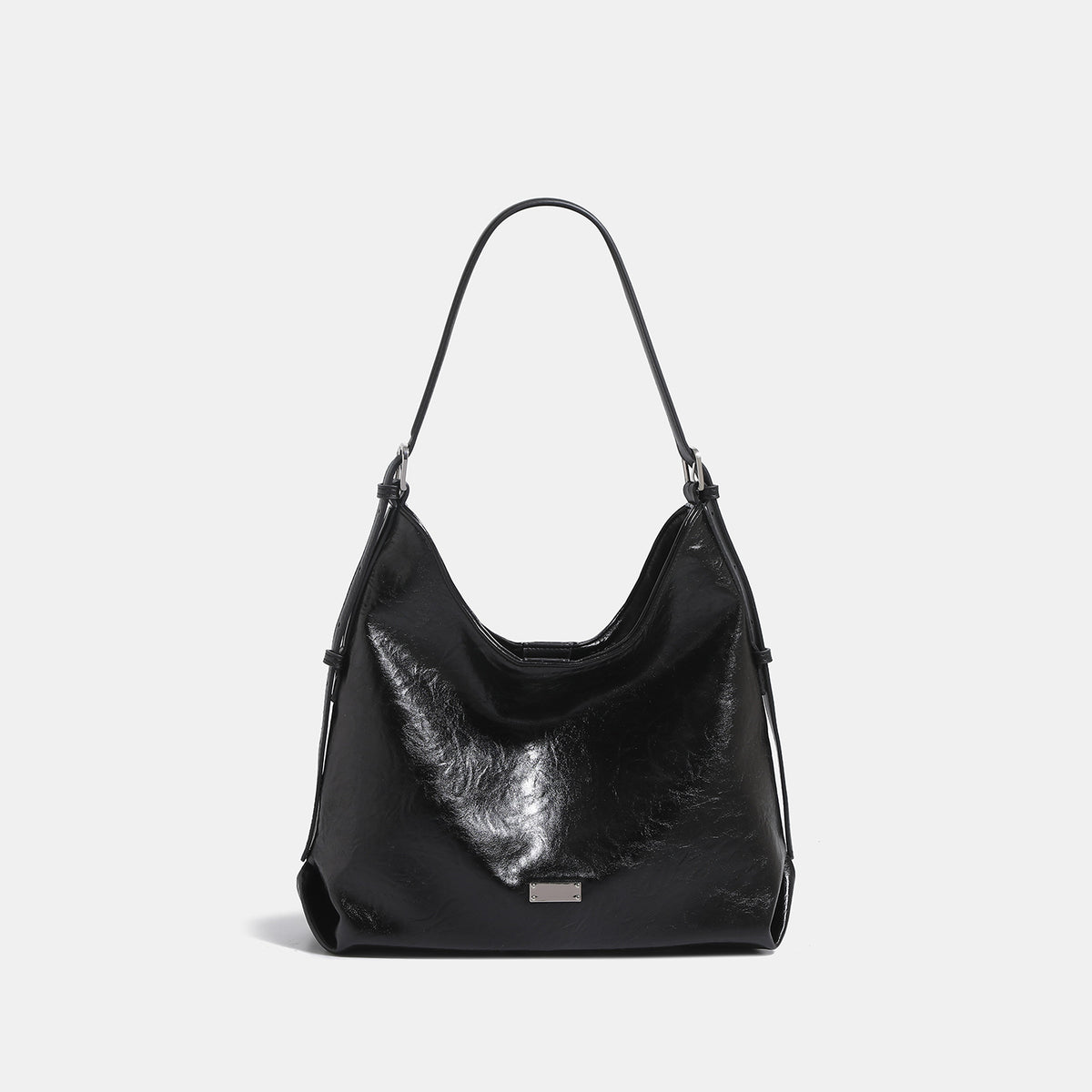 Slouchy hobo shoulder bag with glossy wrinkled leather-look finish, adjustable strap, and snap closure, detail view 7