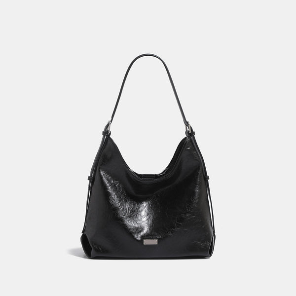 Slouchy hobo shoulder bag with glossy wrinkled leather-look finish, adjustable strap, and snap closure, detail view 7