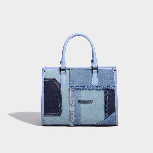 Structured patchwork denim tote bag with frayed panel seams, dual top handles, and silver-tone hardware, detail view 3
