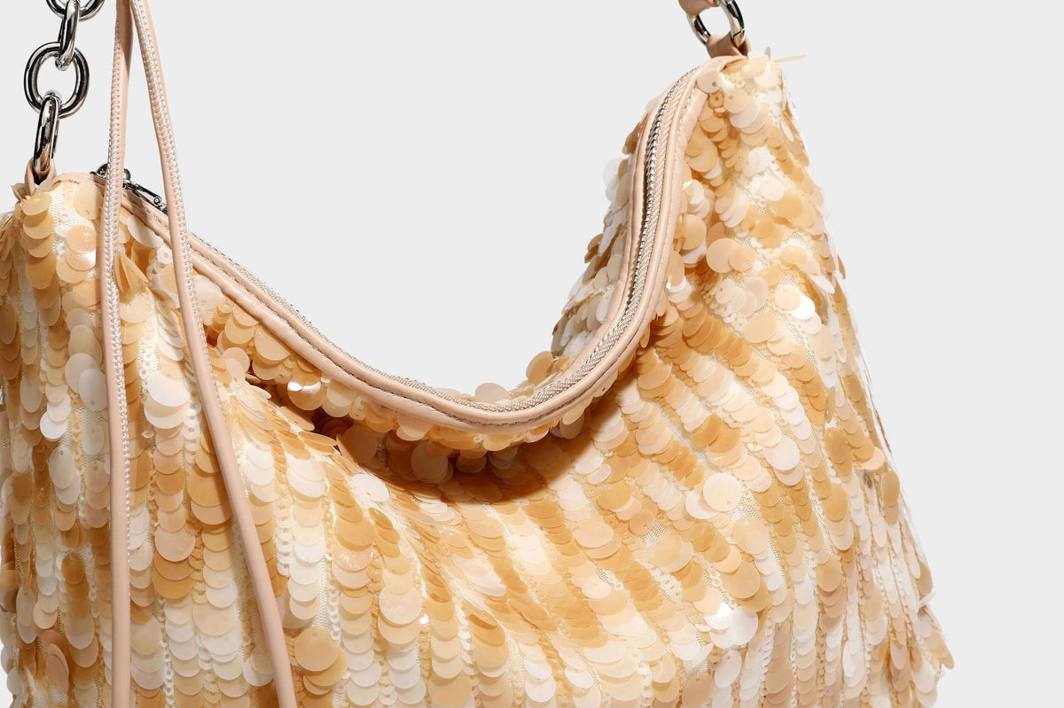 Slouchy paillette sequin hobo shoulder bag with zip closure and adjustable leather-look strap with silver chain hardware