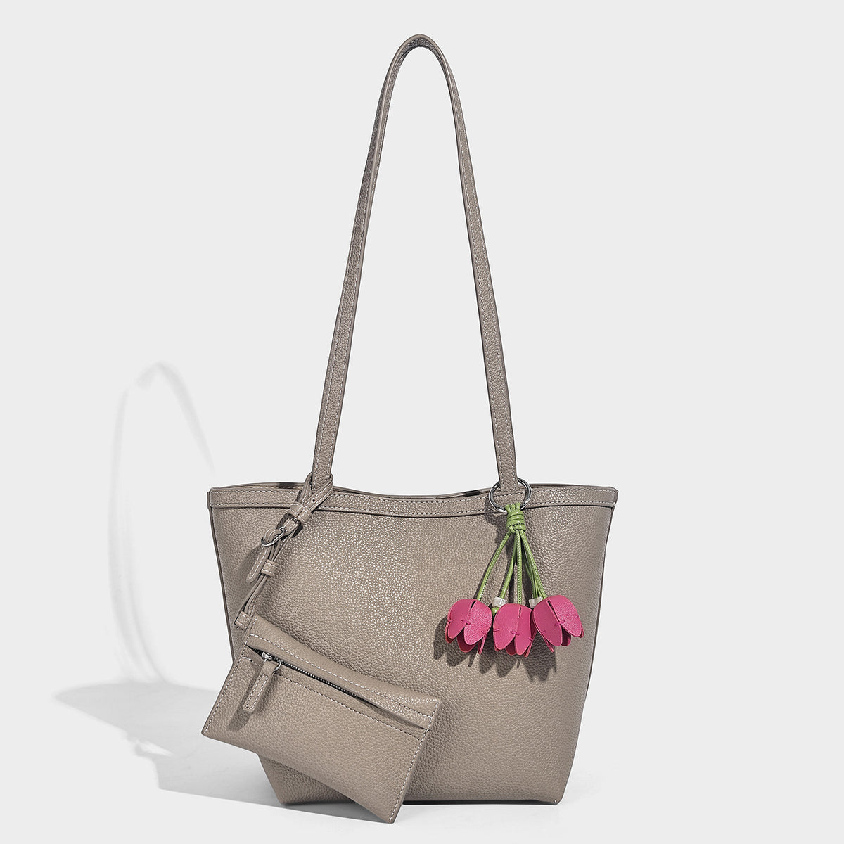 Structured pebbled leather-look tote bag in taupe with long shoulder strap, detachable zip pouch, and pink tulip flower