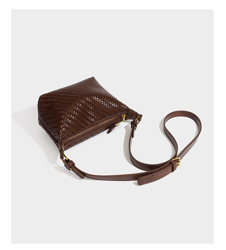 Small glossy basket-weave hobo shoulder bag in brown with knotted top handle, flap accent pocket, and gold-tone hardware