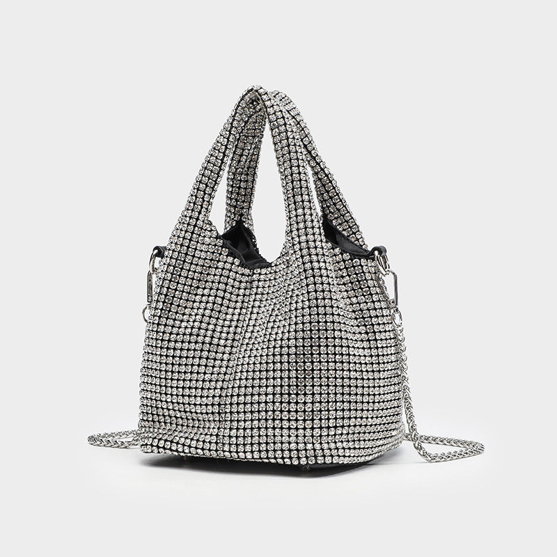 Small all-over rhinestone crystal bucket bag with twin handles and detachable chain shoulder strap, front view